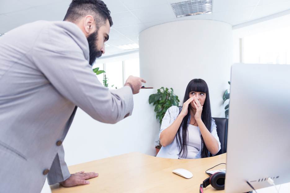 Woman being yelled at by male boss - Sexual Discrimination